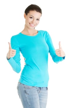 Beautiful young woman in casual clothes gesturing thumbs up.