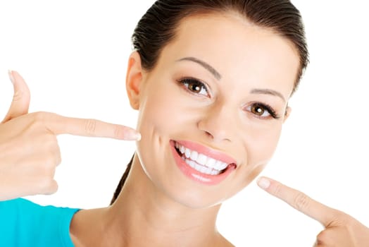 Woman showing her perfect straight white teeth.