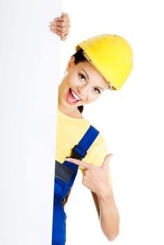 Female construction worker with blank board, isolated on white