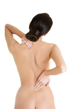 Young woman with pain in her back. Isolated on white