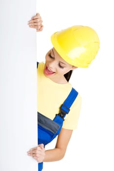 Female construction worker with blank board, isolated on white