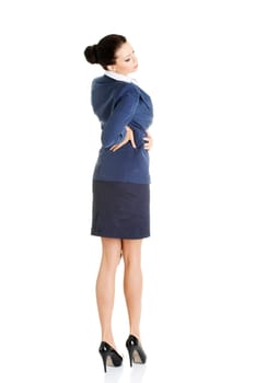 Business woman with back pain after long work. Isolated on white