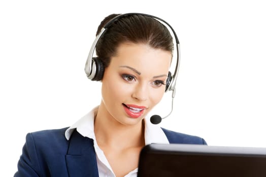 Beautiful young call-center assistant smiling , isolated on white