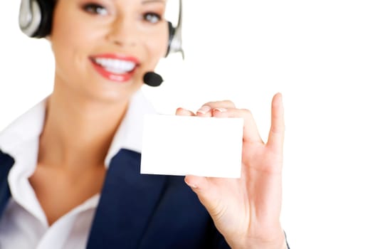 Smiling customer service representative with headset holding a blank empty card. Isolated on white background.