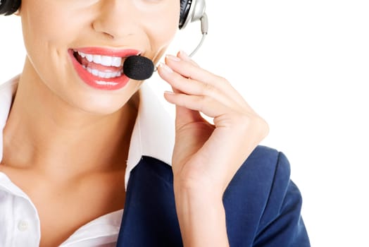 Pretty call-centre assistant smiling at the camera , isolated