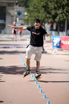 Lyon, France. September 22, 2013. Detail of a cession of exhibition of freestyle slalom in roller inline..