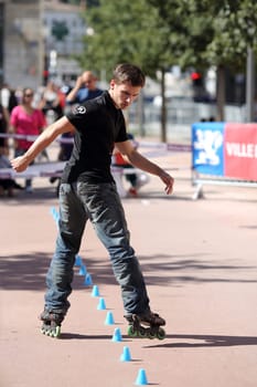 Lyon, France. September 22, 2013. Detail of a cession of exhibition of freestyle slalom in roller inline..