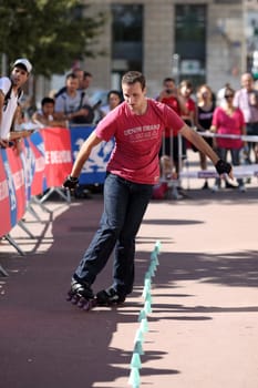 Lyon, France. September 22, 2013. Detail of a cession of exhibition of freestyle slalom in roller inline..