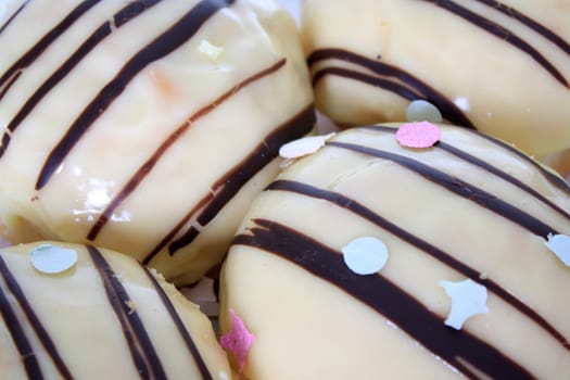 Berliners covered with icing and chocolate