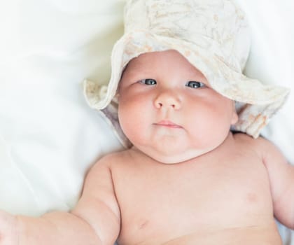 Funny cute baby wearing summer hat