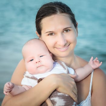 Baby and mom on the beach
