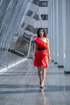 Woman in soaking wet dress walking on street