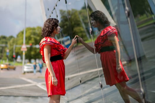 Woman in nice soaking wet dress look her reflection