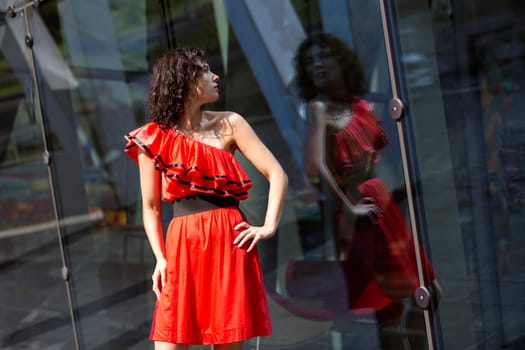 Woman in wet dress reflect at sunny day