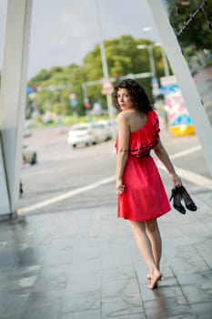 Woman in red dress looking back over shoulder