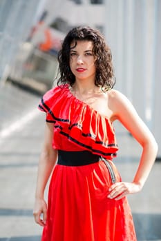 Woman in nice soaking wet dress posing on square