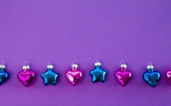 Purple background for Christmas with colorful hearts