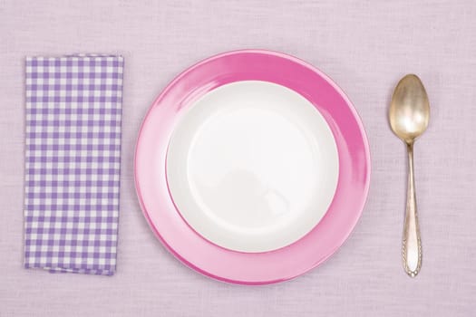 Plate with spoon and napkin with purple checks