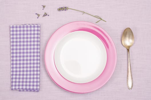 Plate and spoon with napkin and purple lavender