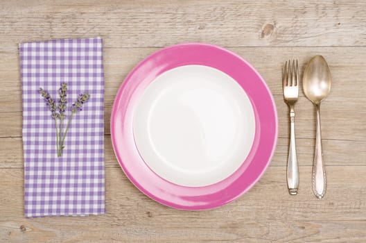 Knife and fork with violet checkered napkin