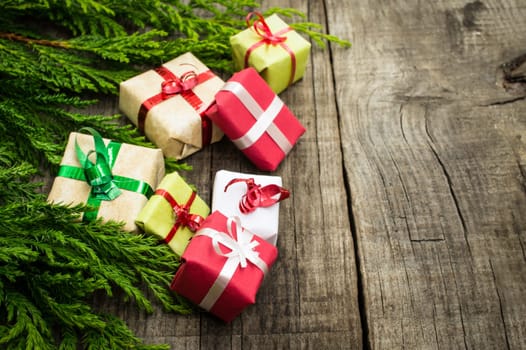 Christmas Decoration with presents on wood textured background.