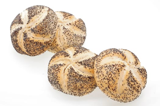 Close up of poppyseed bread rolls on a white background