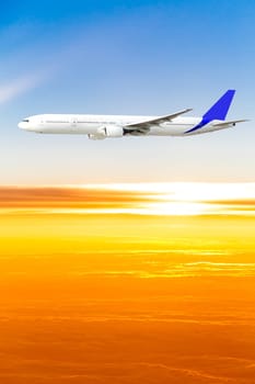 Airplane in the sky at sunset. A passenger plane in the sky