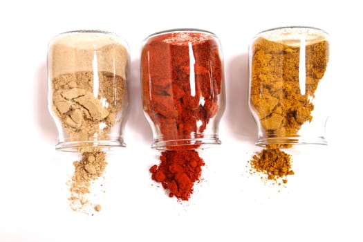 Variety of spices in a glass pot..