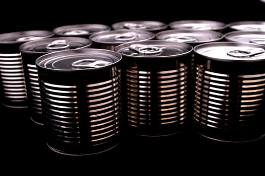 A group of black cans .