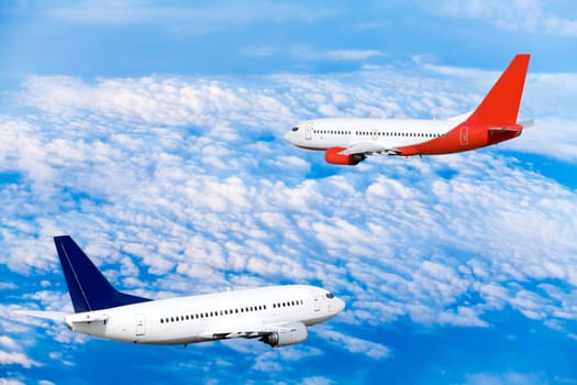 Airplane at fly on the sky with clouds