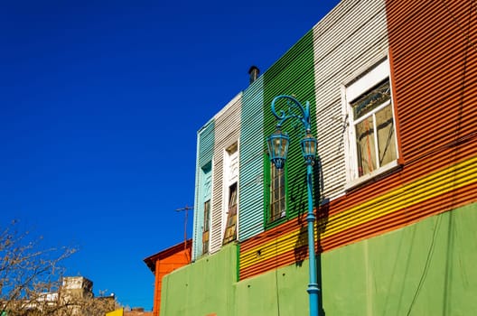Blue lamppost against old building in La Boca neighborhood in Buenos Aires, Argentina