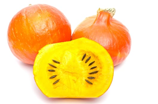 Pumpkin with pumpkin seeds on white background