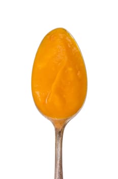 White insulated pumpkin cream soup on a spoon