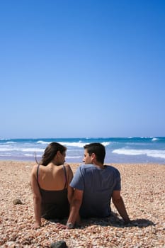 Couple sitting on the beach