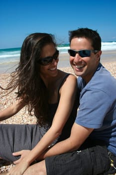 Couple sitting on the beach