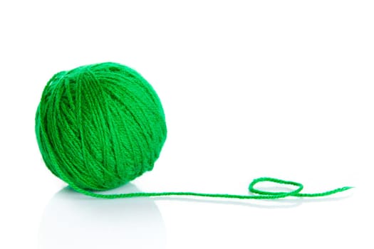 Green wool yarn ball isolated on white background