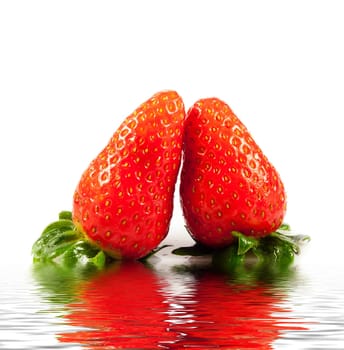 Strawberries with leaves. Isolated on a white background.