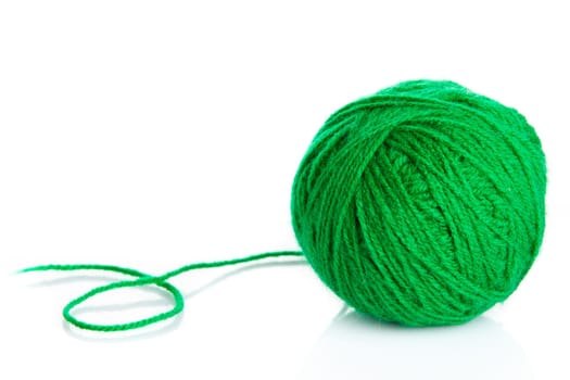 Green wool yarn ball isolated on white background