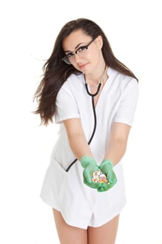 woman doctor with pills in hand. Female doctor holding many pills in her hands