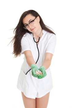 woman doctor with pills in hand. Female doctor holding many pills in her hands