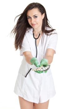 woman doctor with pills in hand. Female doctor holding many pills in her hands