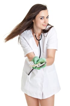 woman doctor with pills in hand. Female doctor holding many pills in her hands
