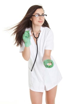 woman doctor with pills in hand. Female doctor holding many pills in her hands