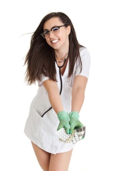 woman doctor with pills in hand. Female doctor holding many pills in her hands