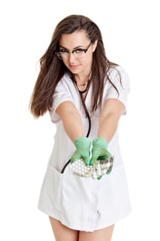 woman doctor with pills in hand. Female doctor holding many pills in her hands