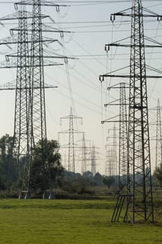 A large number of overhead power lines in vanishing point perspective