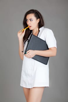 medical doctor woman with stethoscope. A female doctor with a folder