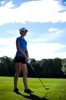 Woman playing golf