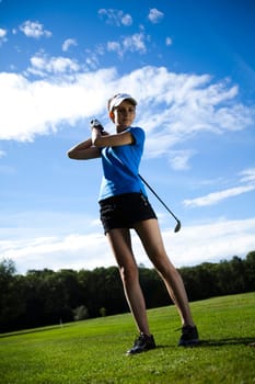 Woman playing golf