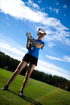 Woman playing golf